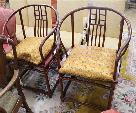 A pair of Chinese hardwood elbow chairs,